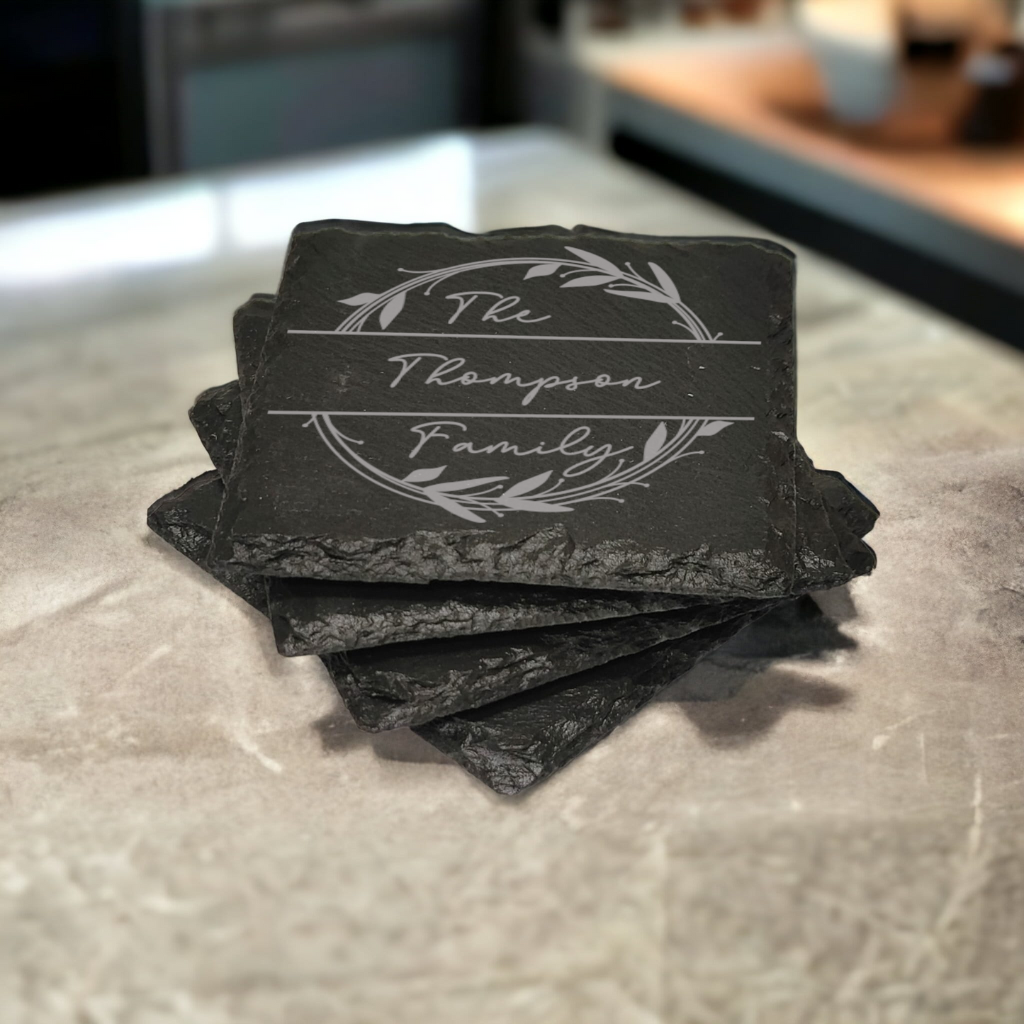 Family name monogram (Style 2) on set of 4 slate coasters with font of your choice
