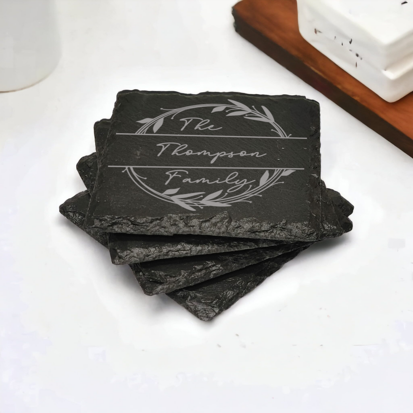 Family name monogram (Style 2) on set of 4 slate coasters with font of your choice