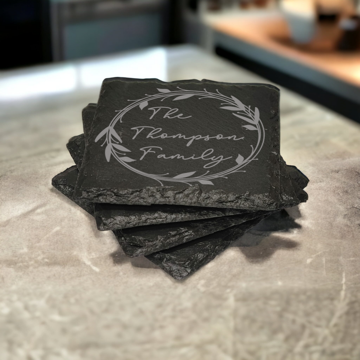 Family name monogram (Style 1) on set of 4 slate coasters with font of your choice