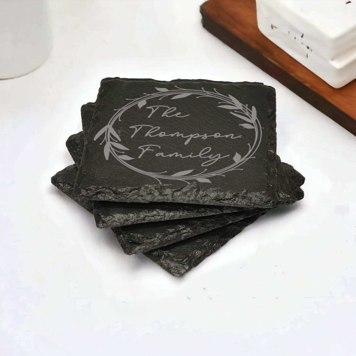 Family name monogram (Style 1) on set of 4 slate coasters with font of your choice
