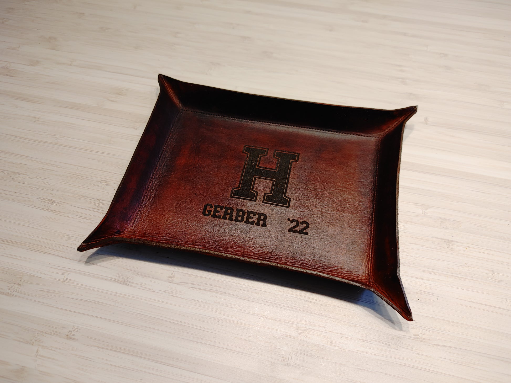 Hand-made all natural leather catch all tray stained brown with logo